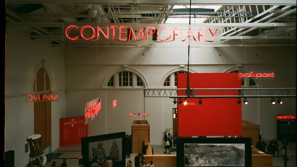 A projection mapped onto a gallery wall inside a contemporary museum space.