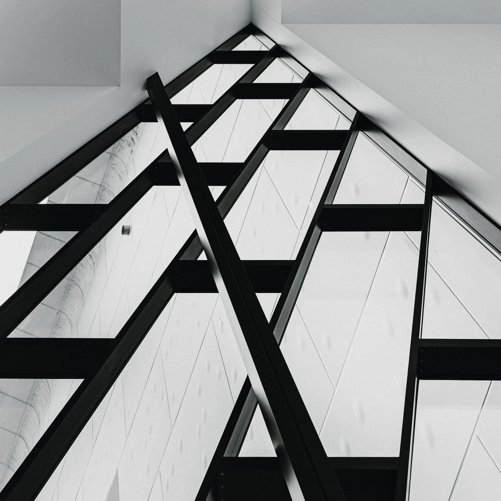 Detail of a silent-housing projector mounted to the museum ceiling.