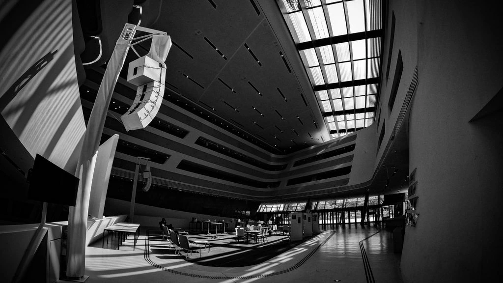Three-wall projection inside a biennial pavilion.